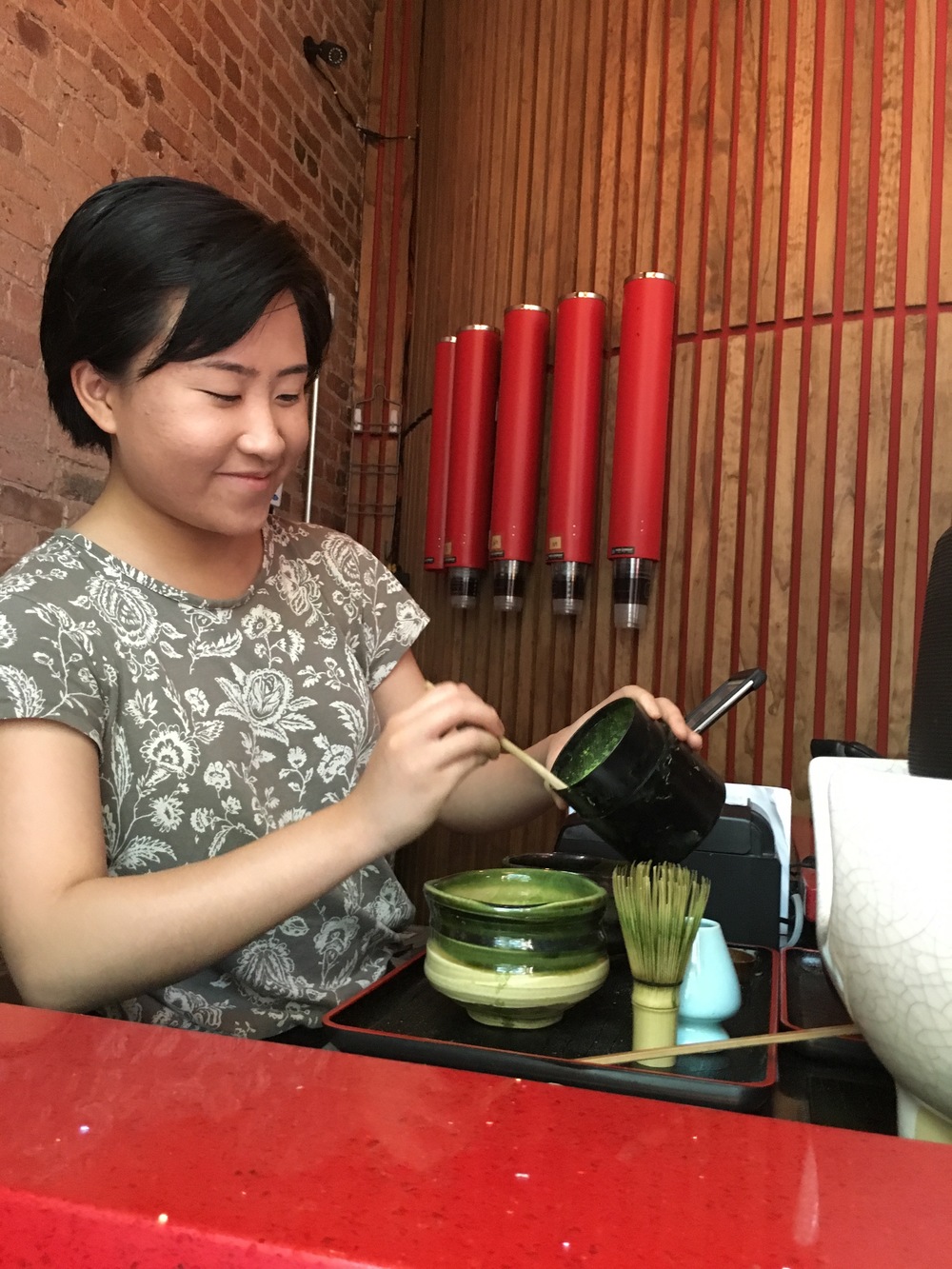 The matcha tea shop owner making our matcha!